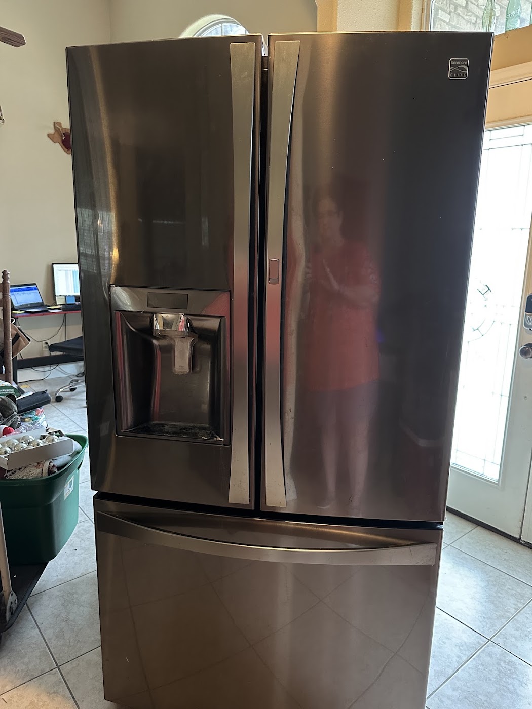 Stainless French-door refrigerator with a water dispenser